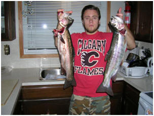 Andy with some winter trout for supper, and the kitchen pose